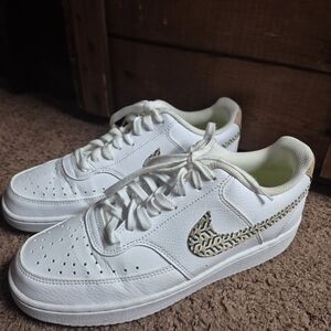 Nike White Sneakers with Black Swoosh